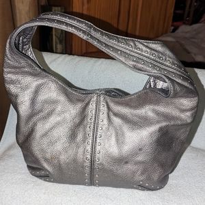 Michael Kors silver metallic studded hobo bag.